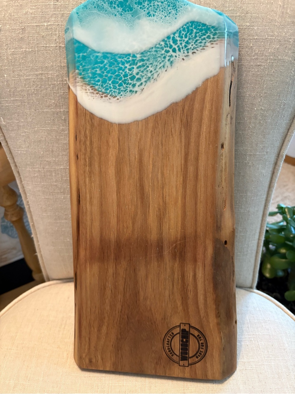 New wooden cutting board with ocean detail accents.